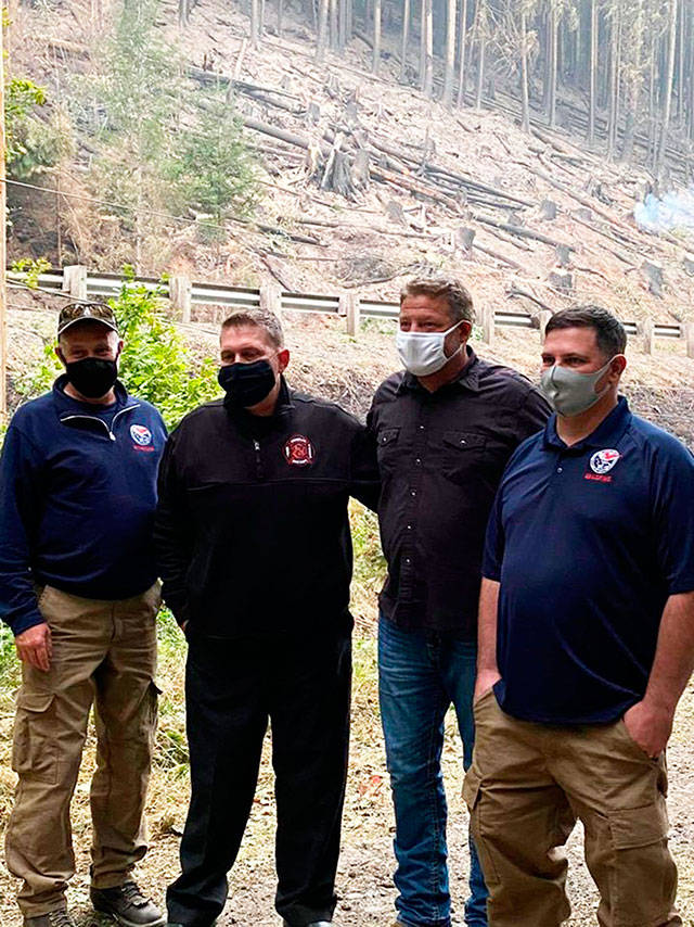 The Enumclaw Fish Fire has shrunk from 150 acres to just about 141, thanks to agressive DNR efforts and favorable weather. Pictured is King County Councilman Reagan Dunn visiting the fire site. Photo courtesy the Department of Natural Resources