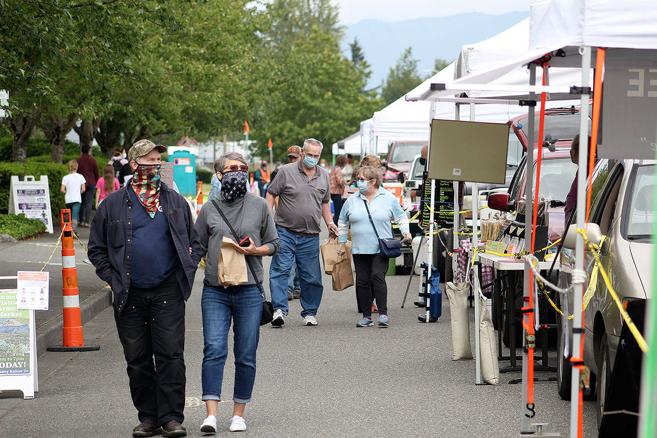 Due to COVID-19, only 24 people were allowed in at the Enumclaw Plateau Farmer's Market at a time this year. Still, more than 4,000 decided to shop at the market between June and September 2020. Photo by Ray Miller-Still