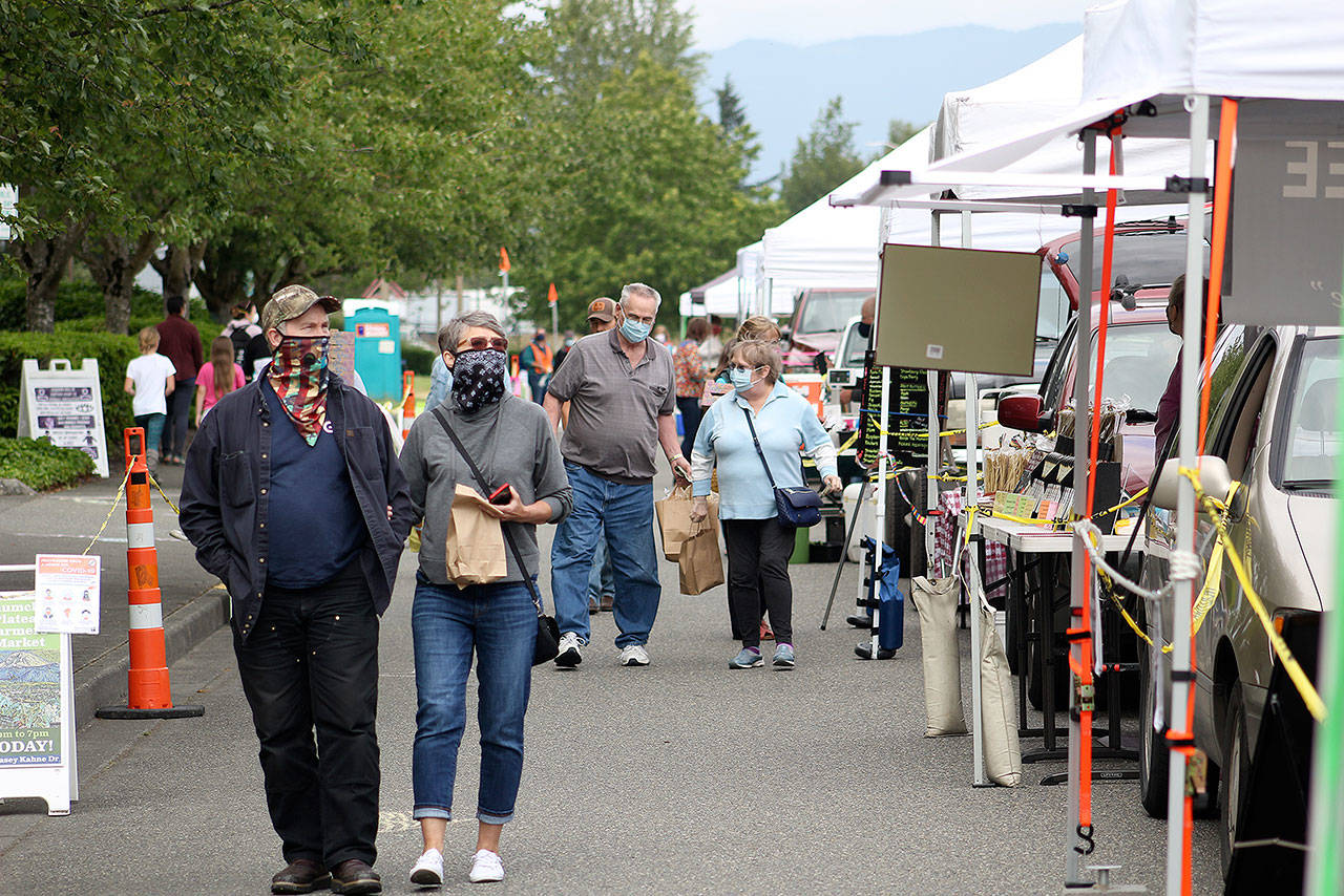 Due to COVID-19, only 24 people were allowed in at the Enumclaw Plateau Farmer’s Market at a time this year. Still, more than 4,000 decided to shop at the market between June and September 2020. Photo by Ray Miller-Still