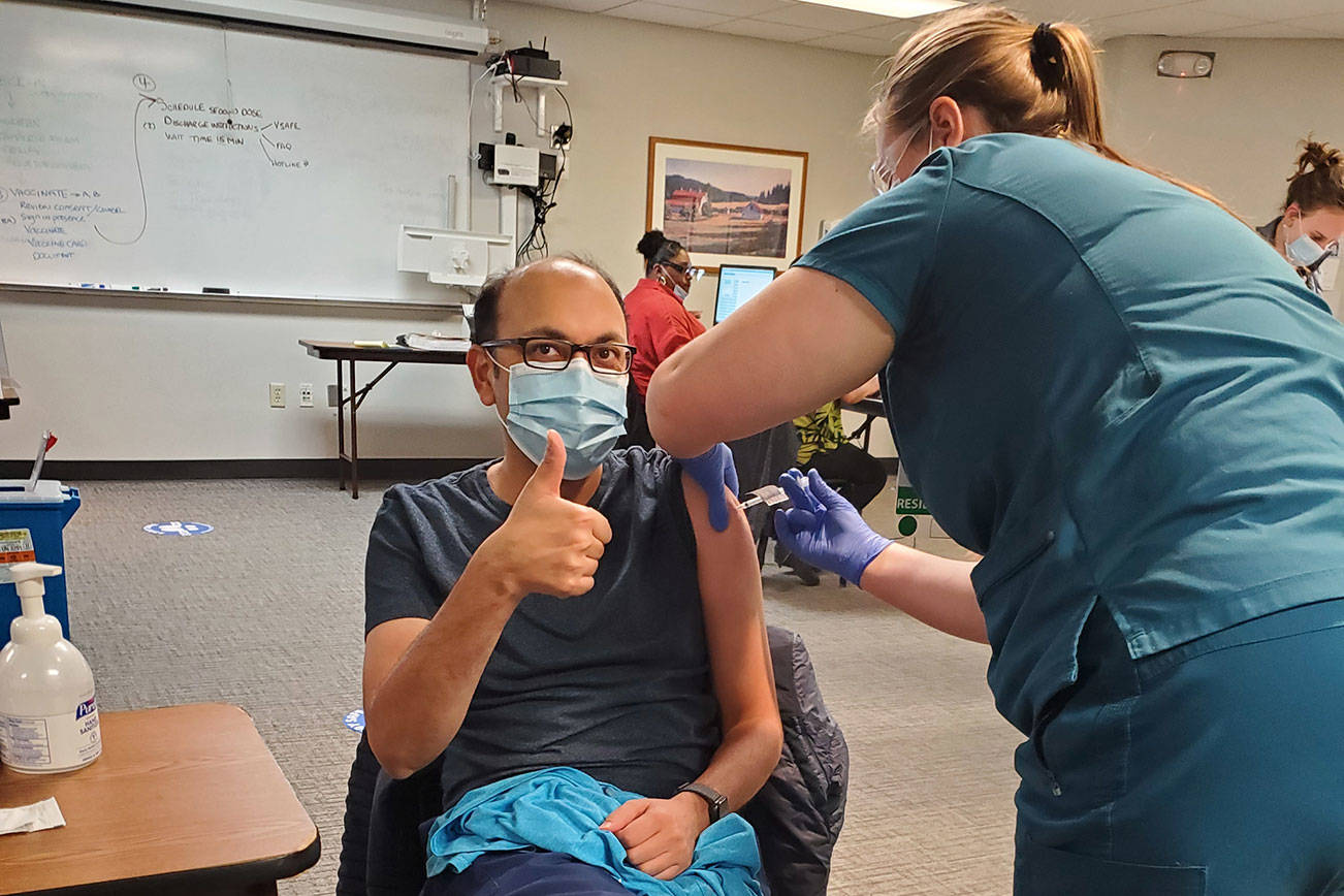 Dr. Amit Desai getting his COVID-19 vaccination at Saint Francis Hospital. Photo courtesy Sarah Ninivaggi