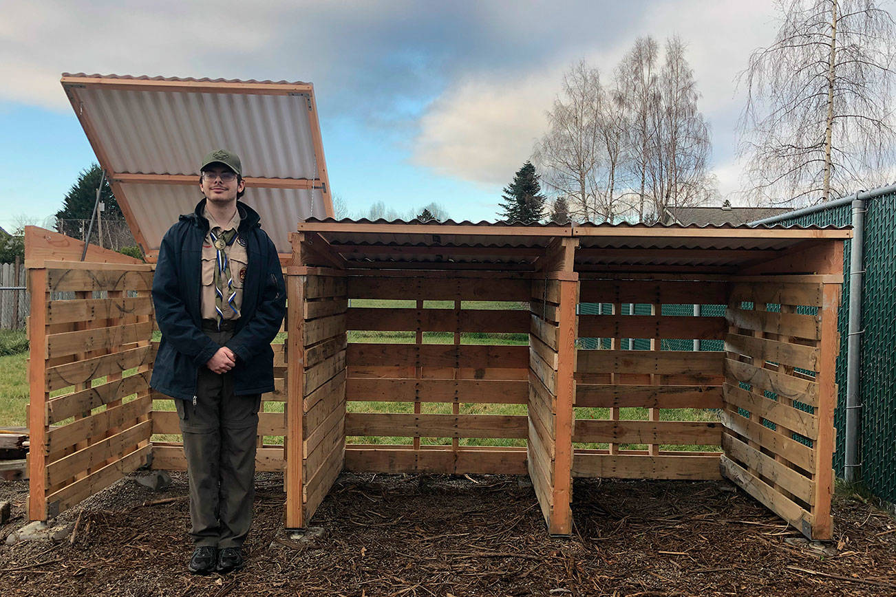 Devin Tompkin stands next to the compost bin he built for the Buckley Mountain View Community Garden. Courtesy photo