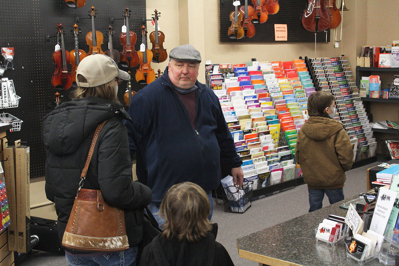 Enumclaw Music owner David Bozich welcoming music students into the practice room. Photo by Ray Miller-Still