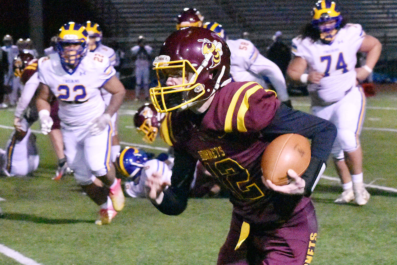 White River's offense received a second-half spark from quarterback Yaz Metzenberg, shown here running for a first down. Photo by Kevin Hanson