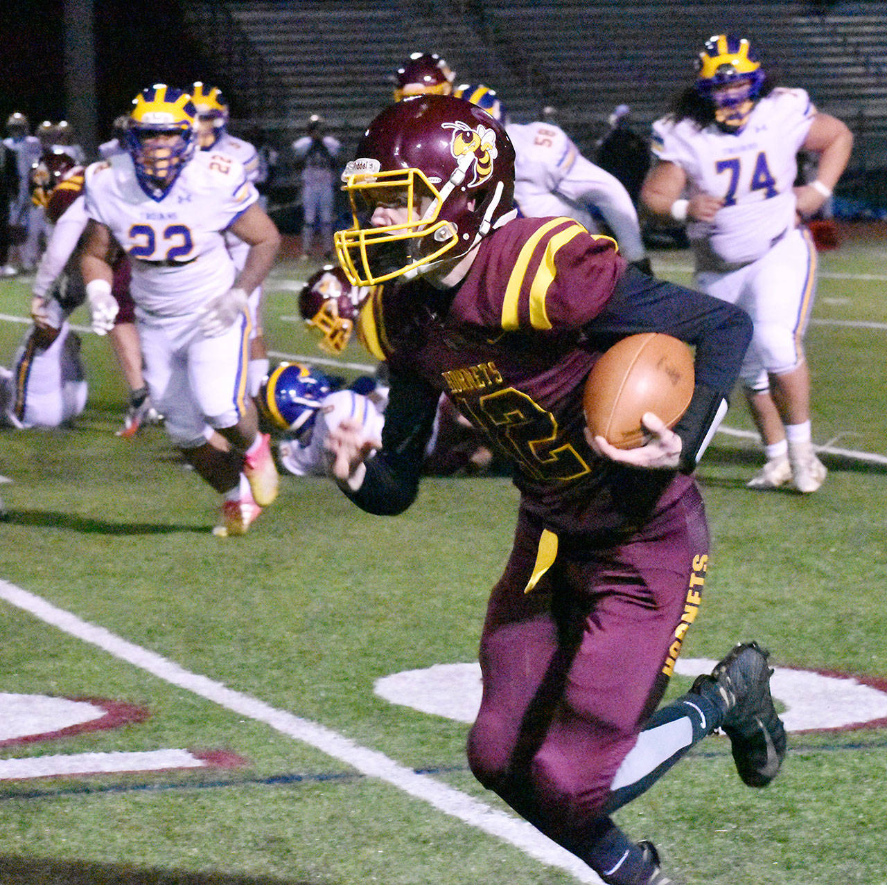 White River’s offense received a second-half spark from quarterback Yaz Metzenberg, shown here running for a first down. Photo by Kevin Hanson
