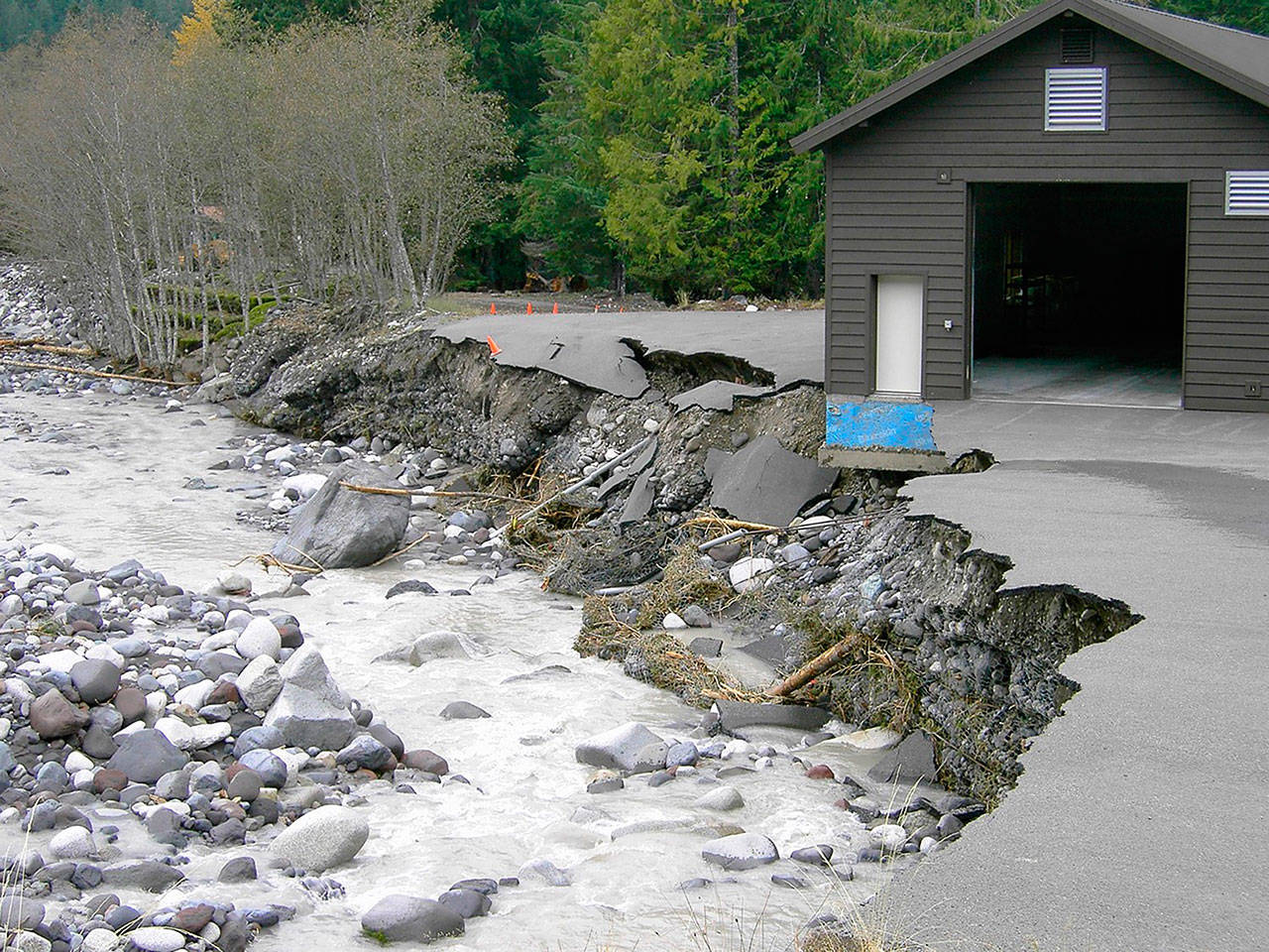 In November 2006, flood damage at Longmire nearly washed the park’s emergency command center into the Nisqually River. Photo courtesy Mount Rainier National Park Archives