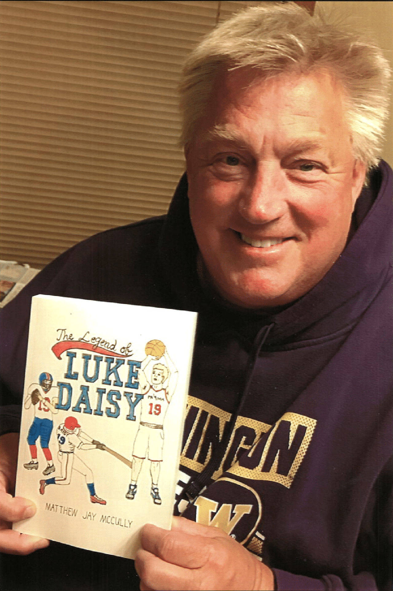 courtesy photo / Courier-Herald
Enumclaw author Matthew McCully holds a copy of his 2019 book “The Legend of Luke Daisy”.
