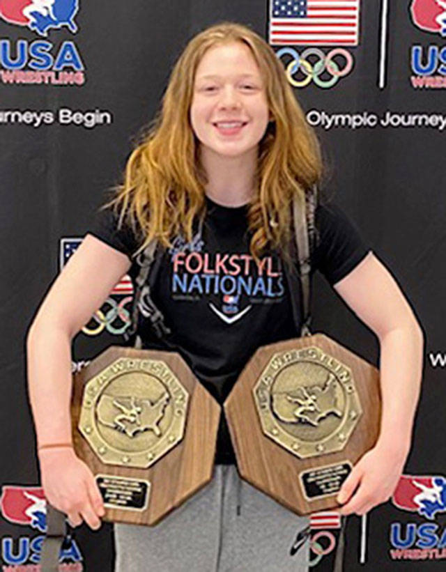 Shelby Moore shows off some of the impressive hardware she earned during a championship effort at wrestling nationals. Submitted photo
