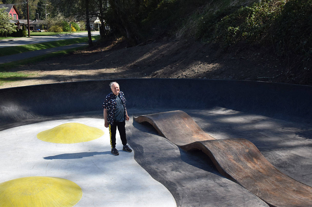 John Hillding stands in the center of the Bacon and Eggs skatepark, which he designed. The Wilkeson skatepark came about from a state grant, Grindline Skateparks, organizing by Hillding and city leaders, and a lot of volunteers. Photo by Alex Bruell