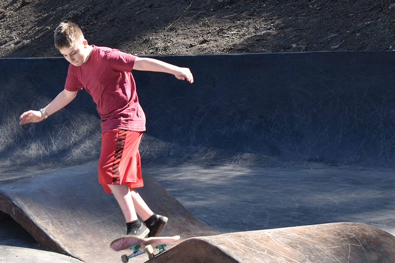 14-year-old William Partin rides the wavy bacon April 20 at Wilkeson’s newest bacon-and-eggs themed skatepark. Photo by Alex Bruell