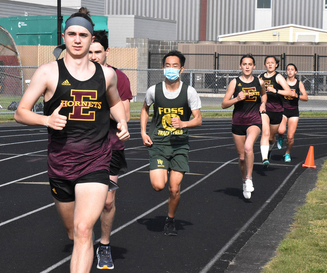 Enumclaw track and field athletes easily ran past Foss High the afternoon of April 28. Because the Falcons brought few competitors to the EHS campus, some of the races had males and females running together. Photo by Kevin Hanson