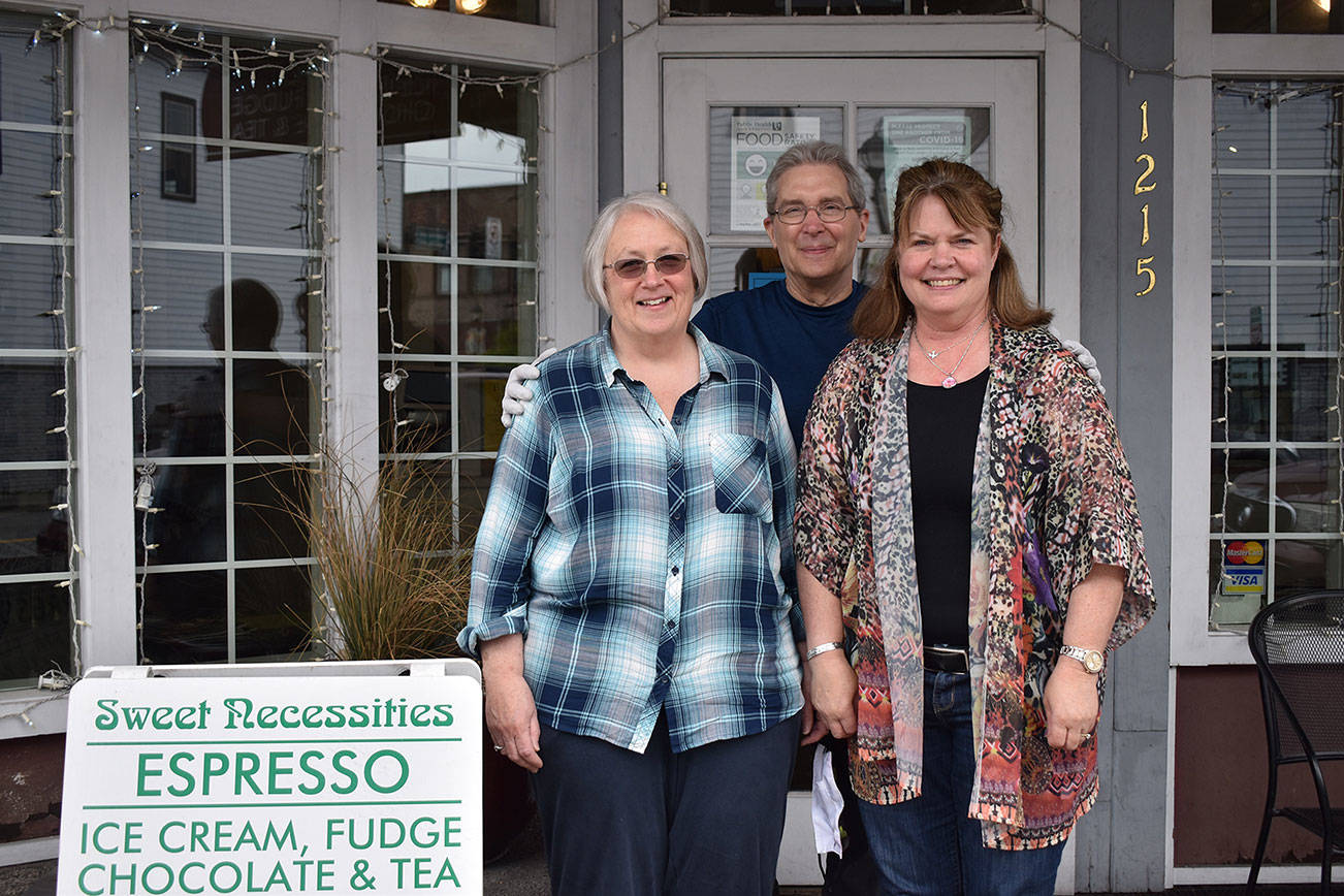 From left to right: Peggy Wenham, Toby Wenham and Sheree Schmidt stand for a picture outside Sweet Necessities on Griffin Avenue. Photo by Alex Bruell