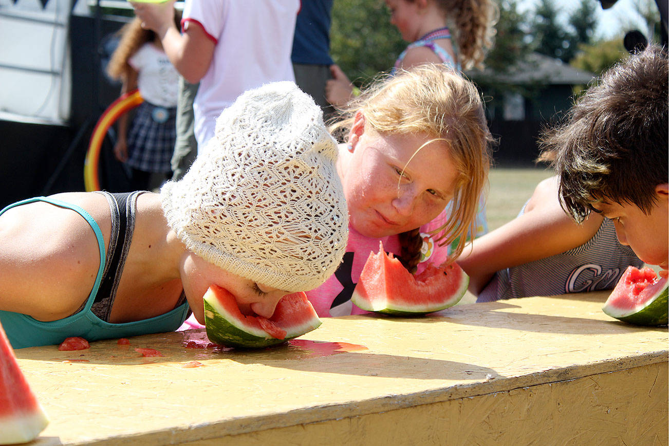 Black Diamond's annual Labor Days events feature many family and kid-friendly activities, like watermelon eating contests. Photo by Ray Miller-Still