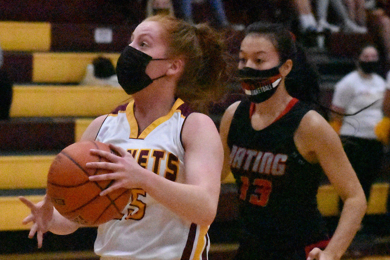 Kara Marecle became the seventh player in the history of White River girls' basketball to score more than 1,000 points. Here, she drives for two more during Friday night's home victory. Photo by Kevin Hanson