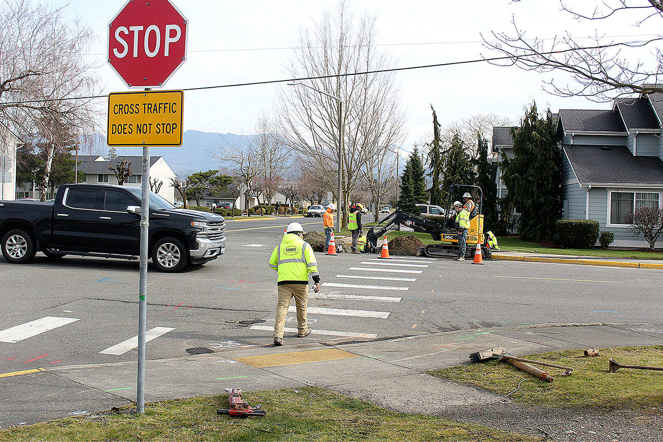 Utility work is performed in the intersection of Semanski and Warner. Photo by Ray Miller-Still