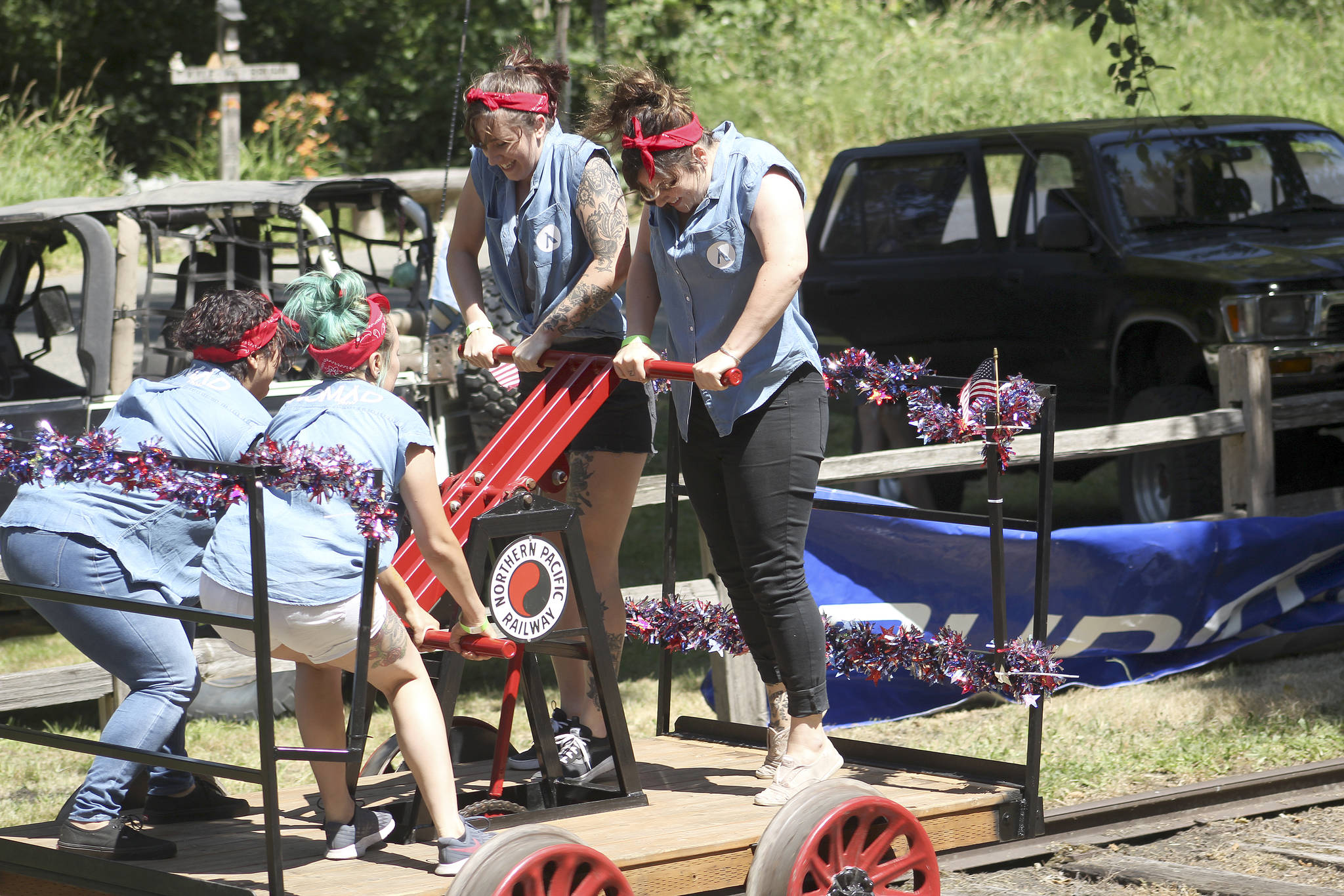 Photo by Ray Miller-Still 
Unless you’re extra burley, Wilkeson Handcar Races competitors often need a team of four people to race their handcar down the 400-foot-plus railroad track.