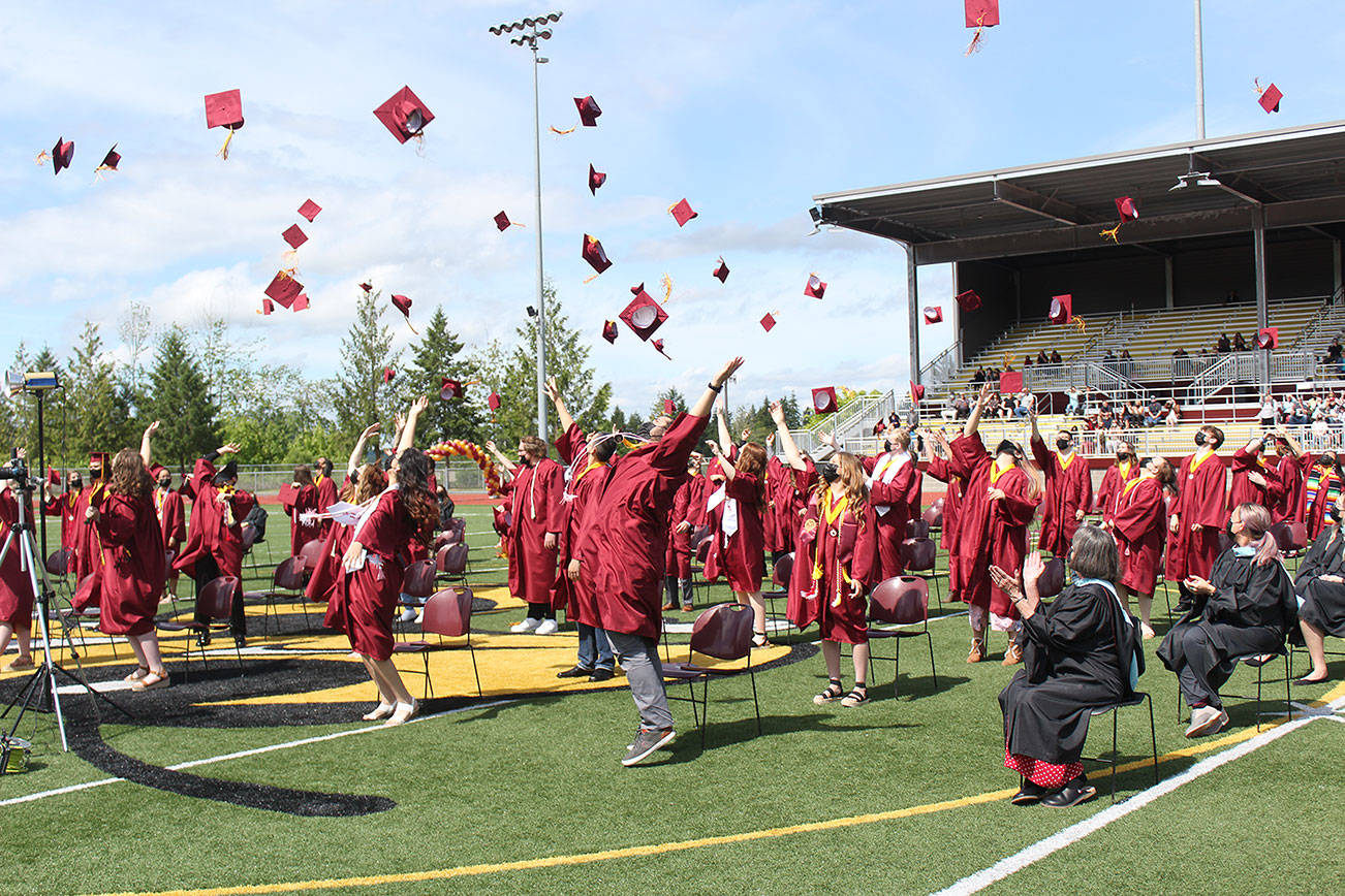 WRHS students toss their caps at the end of their graduation ceremony on June 12. Photo by Ray Miller-Still