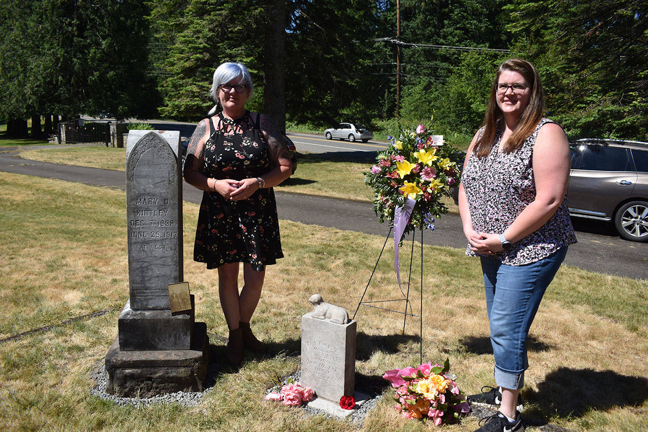 Photo by Alex Bruell
Raynne Woolery Cech, left and Robyn Woolery Salo stand by the gravesite of the Kirtley family, where Daisey’s grave has been laid to rest.