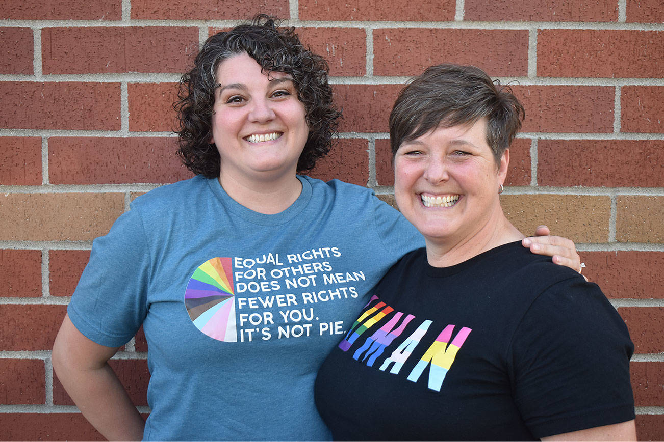 Raelin Crncevich, left, and Jenny Jones pose for a picture Friday, June 25. The couple are organizers of Plateau Pride, a local organization supporting LGBTQ+ people in the Enumclaw Plateau area. Photo by Alex Bruell