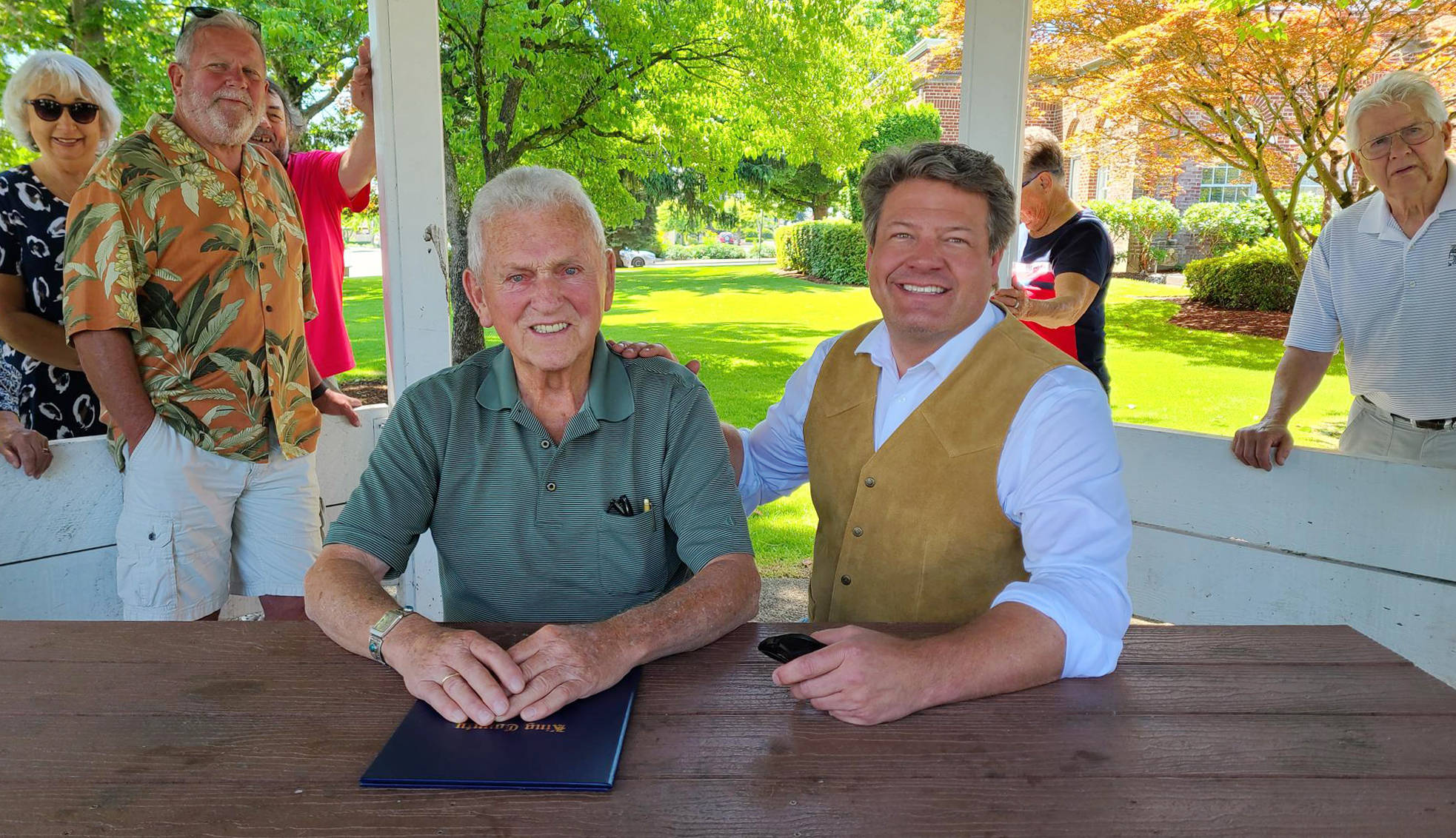 CONTRIBUTED PHOTO 
Joined by family and friends, longtime Enumclaw resident Jim Puttman (left) was honored with a proclamation offered by King County Councilman Reagan Dunn.