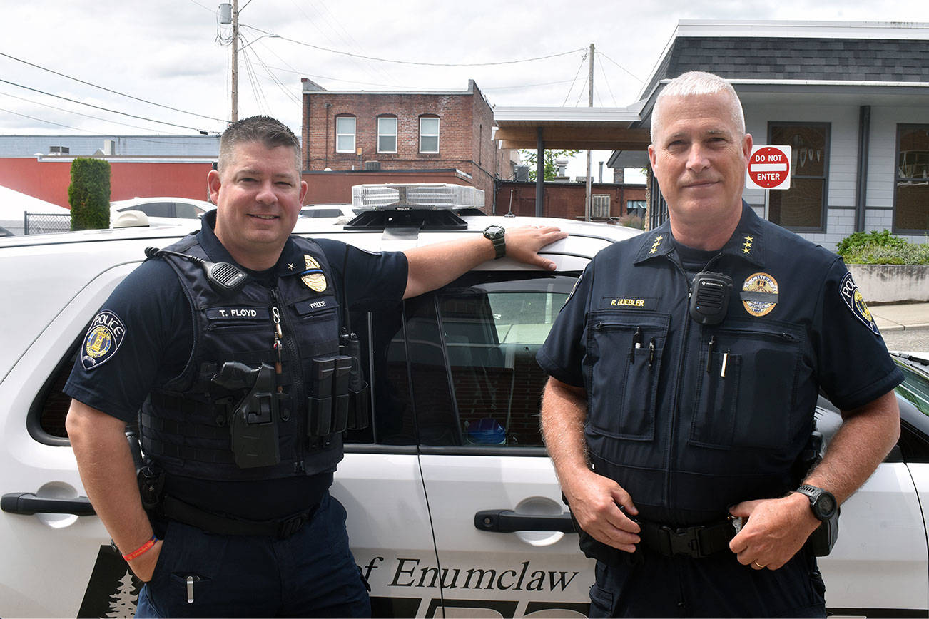 Photo by Alex Bruell
Tim Floyd, left, became chief of the Enumclaw Police Department July 1 following the retirement of former chief Bob Huebler, right.