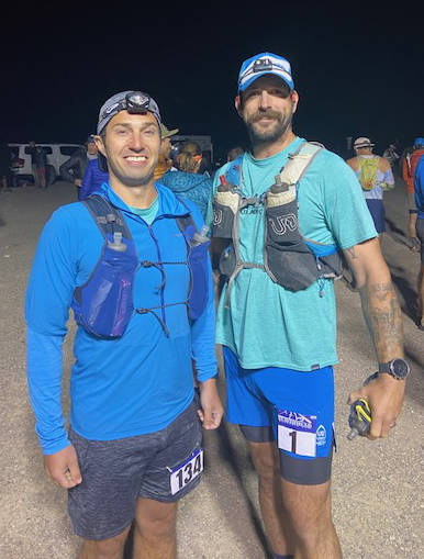 SUBMITTED PHOTO In the 4 a.m. darkness, Plateau residents Tyler Slawson, left, and Eric Alfano stop for a photo before stepping to the Beaverhead Endurance Run starting line.