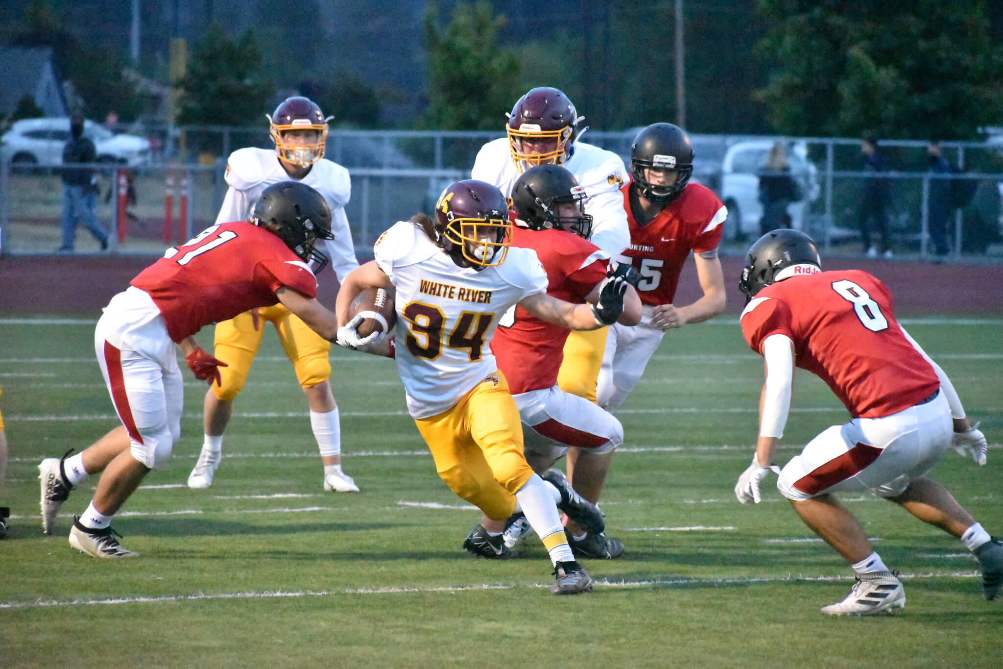 PHOTO BY KEVIN HANSON
White River High’s Payne Plaster evades Orting defenders, picking up a nice gain during Friday night’s road game. The outcome didn’t go the Hornets’ way as the Buckley squad fell to 1-2 on the season.