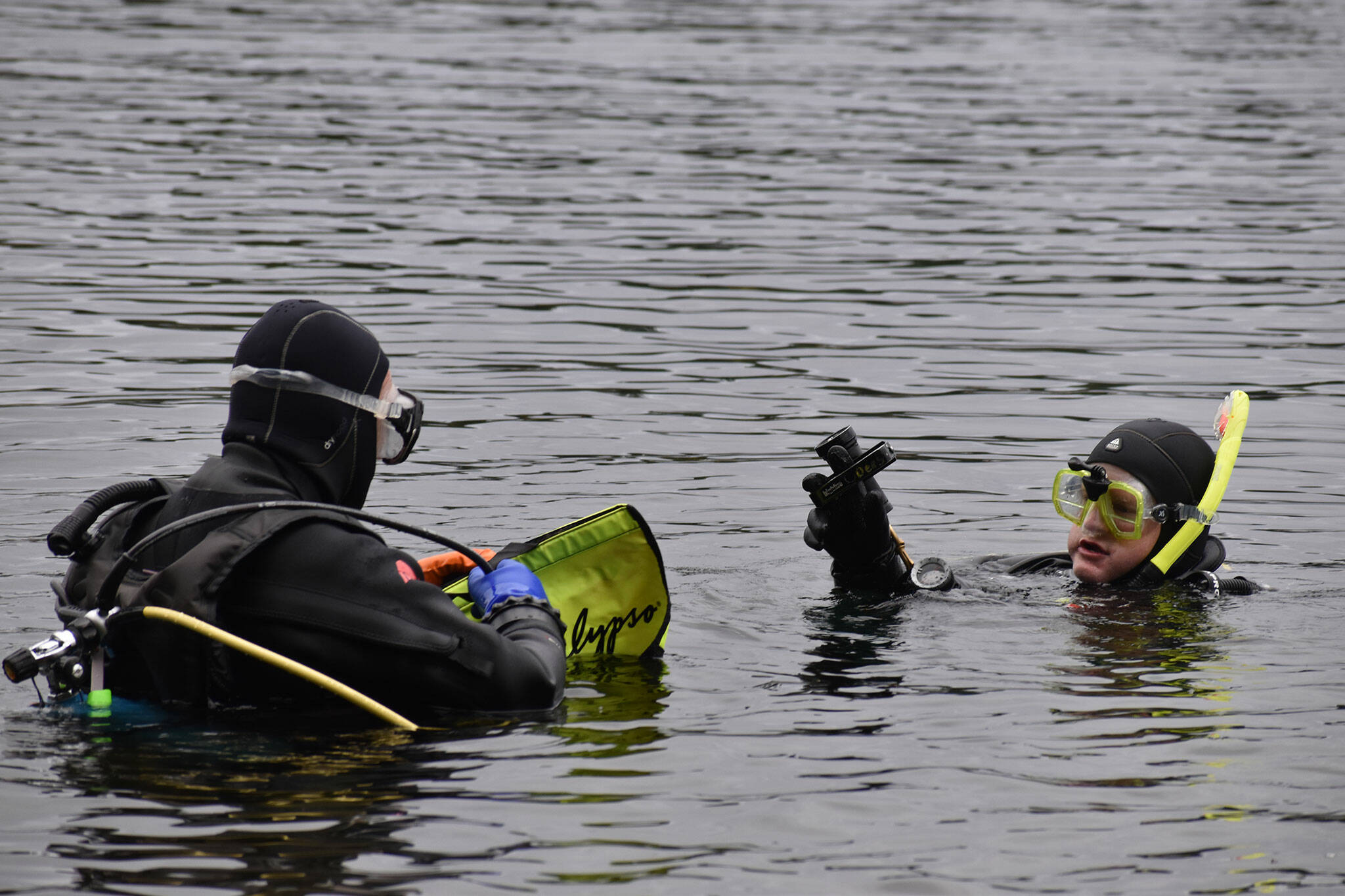 Divers make final preparations before submerging in Lake Sawyer.