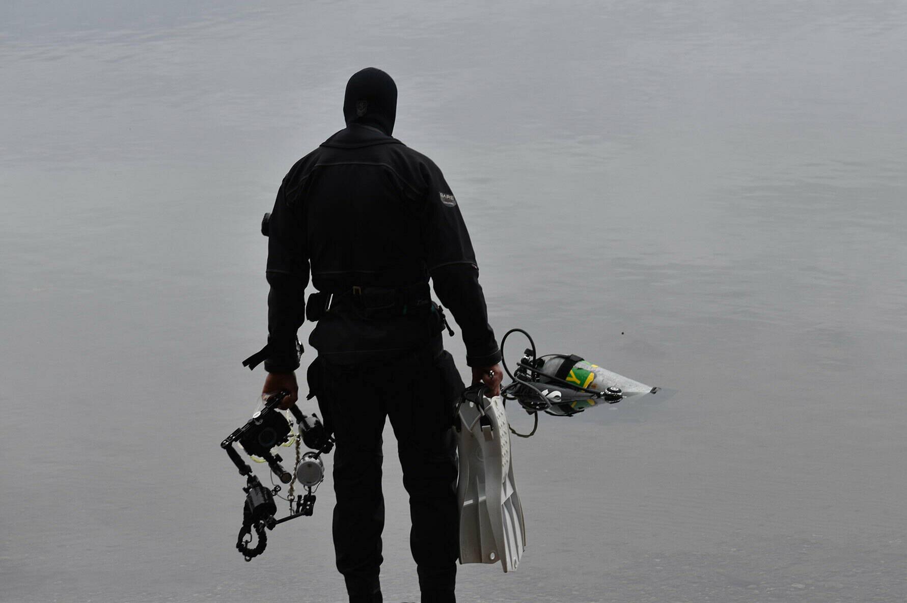 A diver prepares to enter Lake Sawyer.