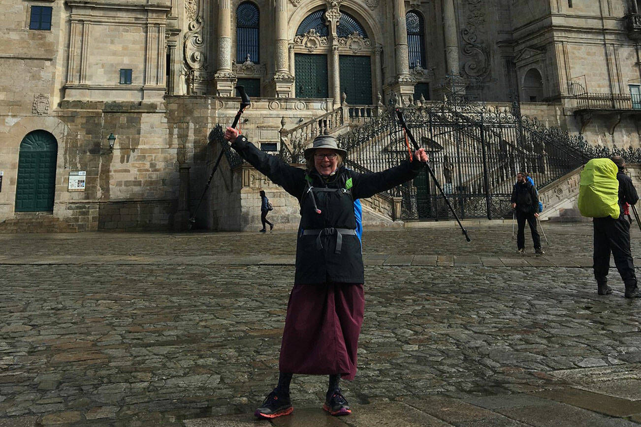 Becky Rush-Peet stands triumphantly in front of the Cathedral of St. James in the city of Santiago de Compostella, the end of her nearly 500-mile and 49 day journey on the Camino de Santiago.