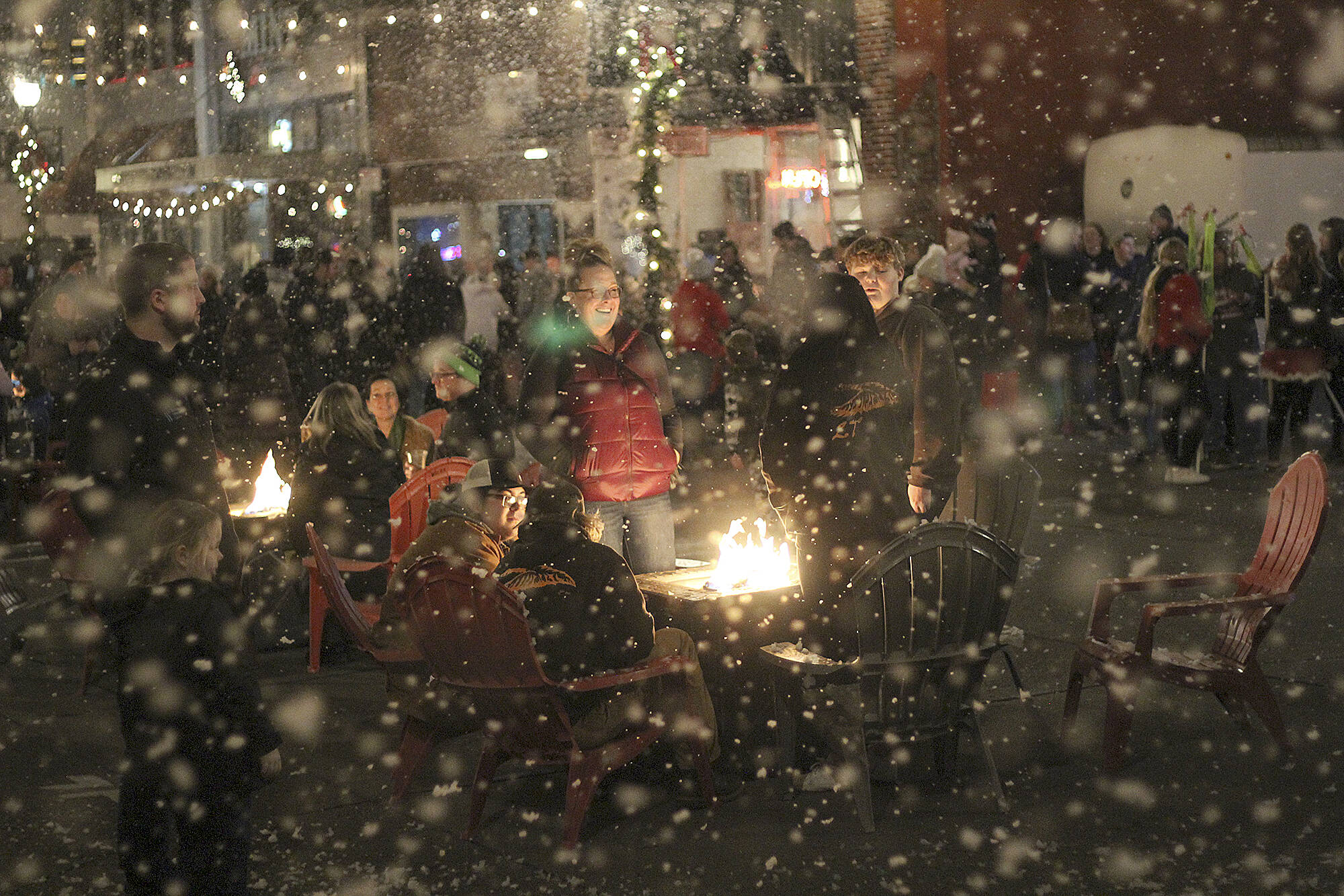 Photo by Ray Miller-Still 
Visitors to Cole Street have been enjoying weekly “snow” events every Friday from 5 to 5:30, when portions of the street close to allow folks to enjoy food and drinks outdoors around fire pits (if the weather is clear). Going into January, the snow events are expected to move to Saturdays at the same time.