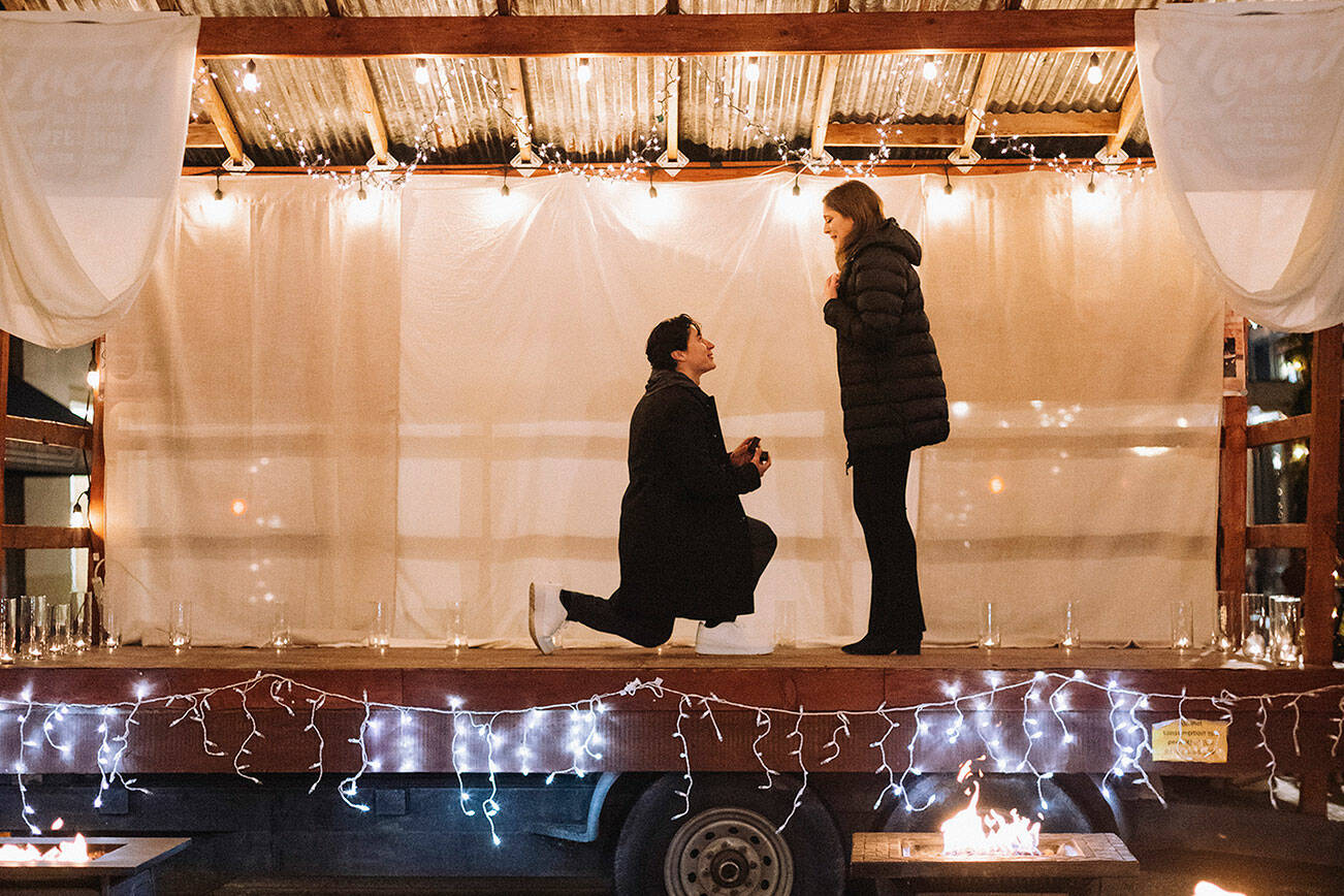 Jorge Espinosa proposed to his fiancée Andrea Abbott on Cole Street last December, with help from local business owners. Photo courtesy Emily Cole / http://emilyanncole.com