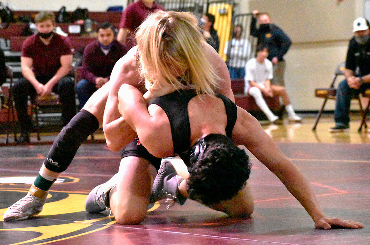 White River’s Cole Cashman dominates a Franklin Pierce opponent during Jan. 19 wrestling action in the Buckley gymnasium. Cashman, a senior competing at 152 pounds, later earned a victory against Enumclaw High during the three-team meet. Photo by Kevin Hanson