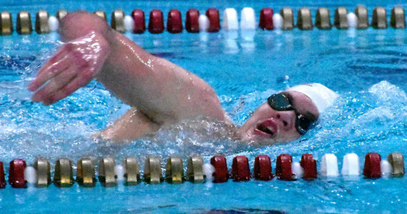 Enumclaw High swimmer McCade Walker competes in a freestyle event during a recent meet at the Enumclaw Aquatic Center.