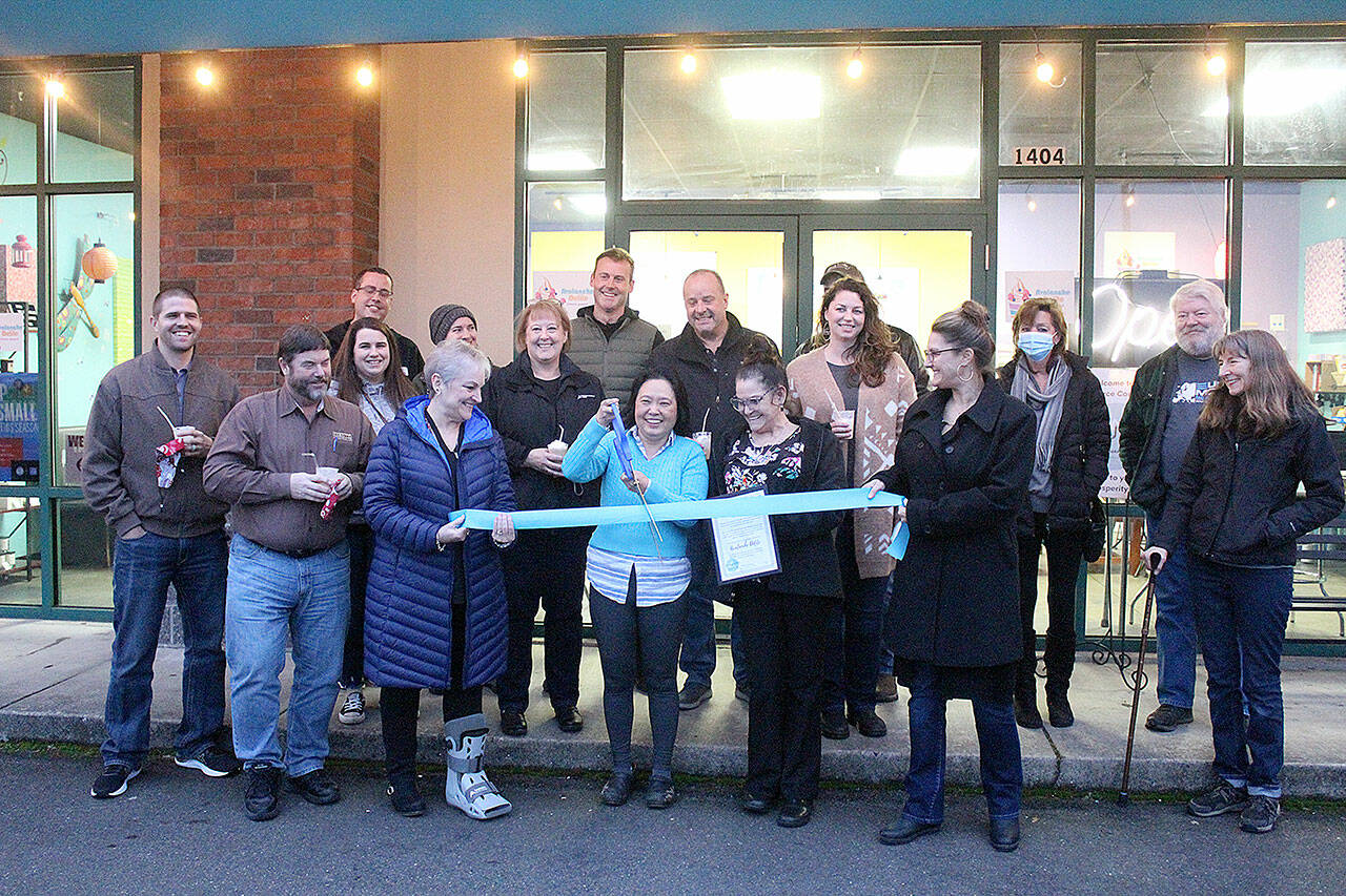 Avalanche Delite owner Debbie Montoya, in blue, with the Enumclaw Chamber of Commerce during a ribbon cutting late January. Photo by Ray Miller-Still
