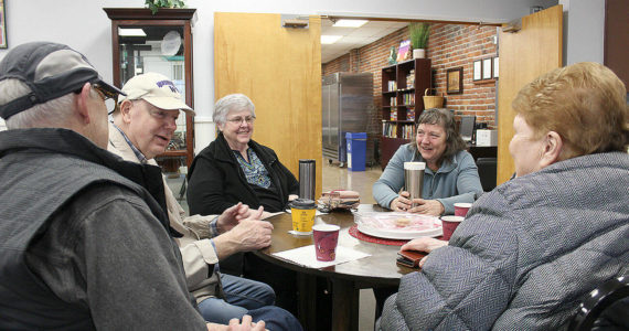 Left to right, Bill Kennedy, Joe Delmore, Darlene DeGroot, Tory Bennett, Cherie Hoselton (not pictured), and Annette Flechner enjoy using the Senior Center for their morning get-togethers on Mondays, Wednesdays, and Fridays after hitting up the local pool. Photo by Ray Miller-Still