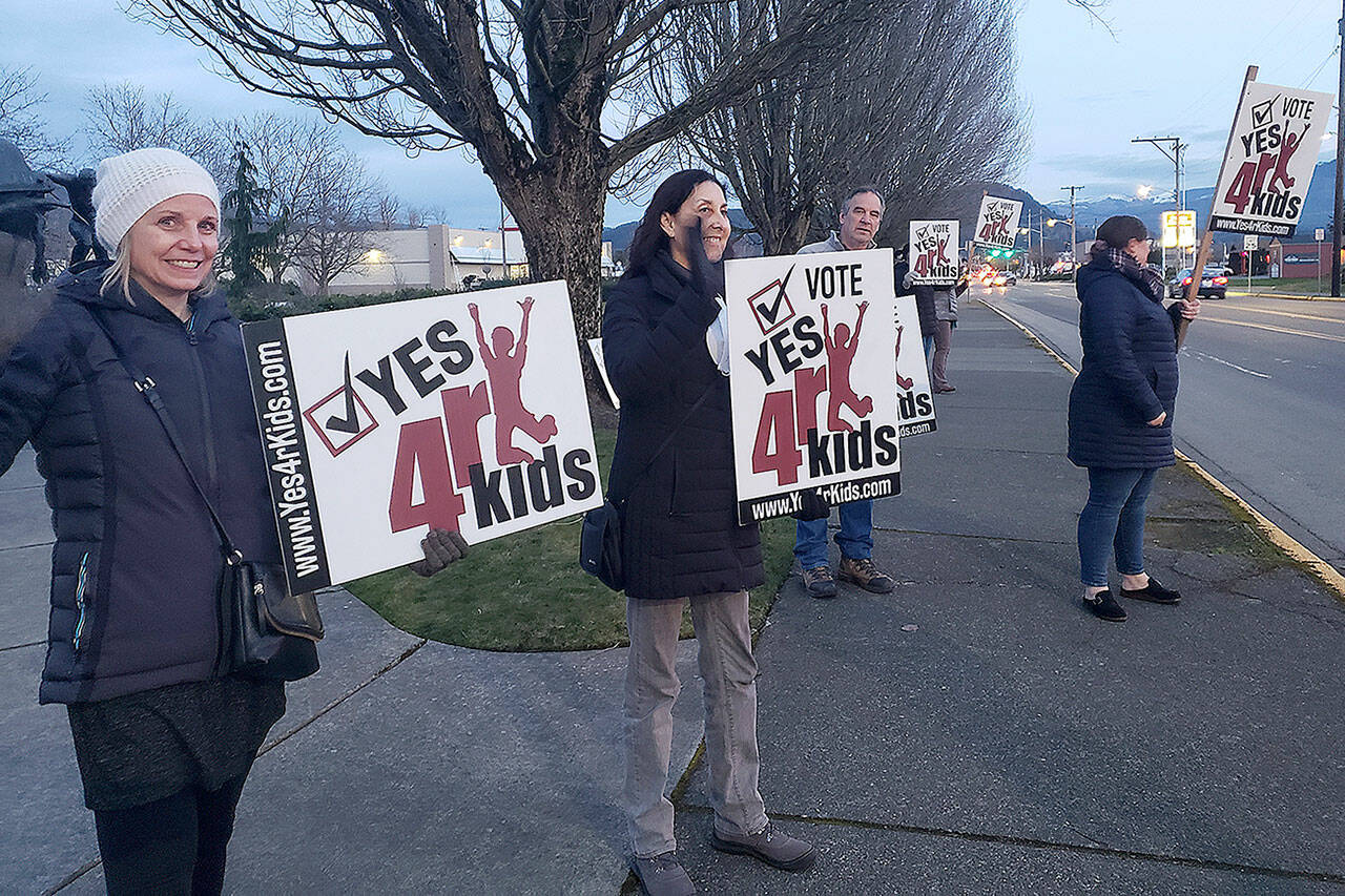 Photo by Ray Miller-Still 
A small group on Griffin Avenue in Enumclaw supporting voting “Yes” on the local school district levy hours before ballots were due.