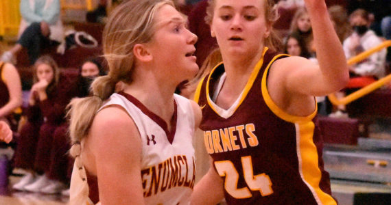 Enumclaw's Charlee Torgison heads to the hoop, guarded by White River's Josie Jacobs, during Friday night basketball action at EHS. It was the South Puget Sound League 2A finale and featured the cream of the crop: White River entered with a 13-0 league record while Enumclaw was just a stop behind at 12-1. Avenging an earlier loss to their Buckley foes, the Enumclaw girls wound up on the winning end of an exciting 70-65 contest. The Plateau neighbors carry co-champion honors into postseason play. Photo by Kevin Hanson