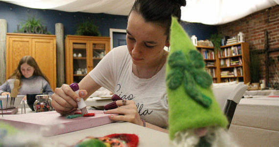 Enumclaw's Urban Sanctuary on Myrtle Avenue is hosting mixed-media art sessions through March 12. Pictured is Emily Gunnells making a felt cherry. Photos by Ray Miller-Still