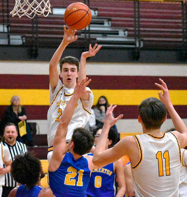 Pictured is Hornets’ Carson Voellger sending a pass to teammate Rylan Donovan (11) during the home-court, 74-62 win game against Bremerton on Feb. 16. File photo by Kevin Hanson