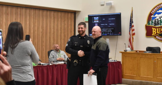 Photo by Alex Bruell
Buckley PD officer Arthur Fetter is promoted to sergeant during the city council meeting March 8. Standing next to him is mayor Beau Burkett.
