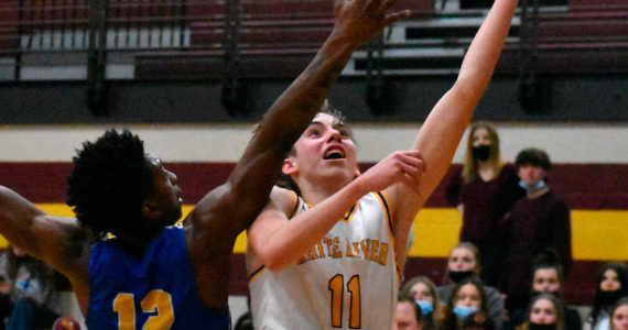 Rylan Donovan, right, a senior member of the White River Boy's Basketball team, is the team's Most Valuable Player this year. (File photo)