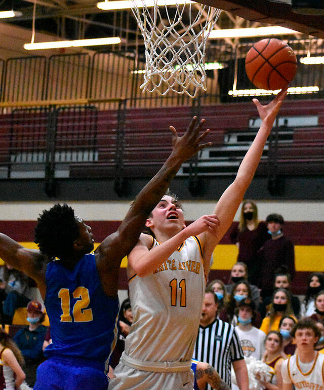 Rylan Donovan, right, a senior member of the White River Boy’s Basketball team, is the team’s Most Valuable Player this year. (File photo)