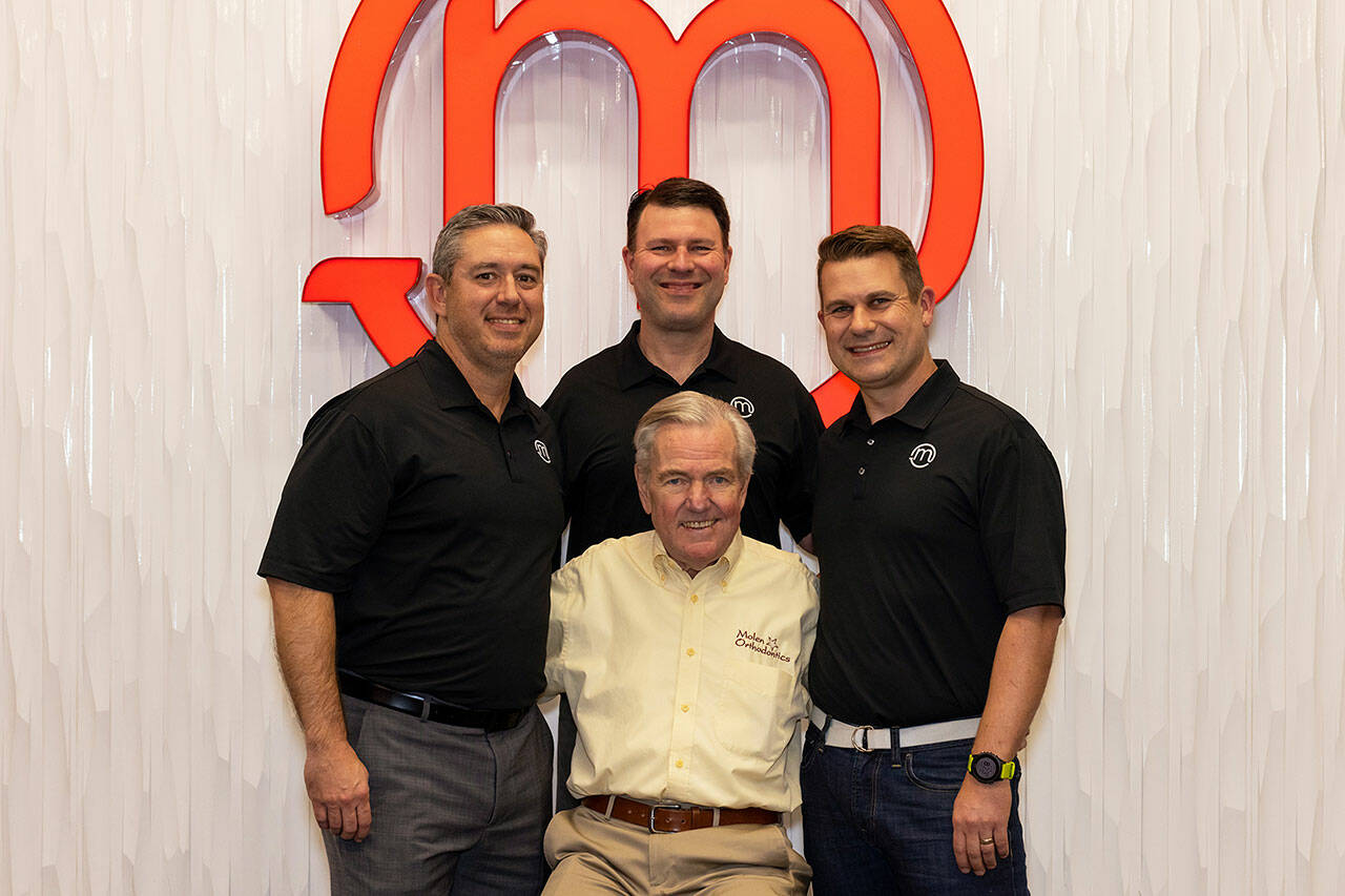 Bruce Molen, front, started Molen Orthodontics in Auburn March 1972. His sons, Rick, center back, and Aaron, right, joined the practice in the 2000s, while Ricks schoolmate Chris became a part of the team in 2016. Photo by Heather Boren / <a href="http://www.heatherborenphotography.pic-time.com" target="_blank">heatherborenphotography.pic-time.com </a>