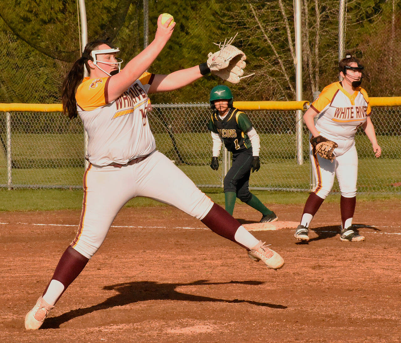 The White River girls jumped out to an undefeated start of the fastpitch season, going 5-0 through games of last week (4-0 in SPSL 2A play). Among the reasons was the pitching of freshman Elliotte Kajita, shown here delivering during an 18-0, home-field victory on March 22. She picked up another victory two days later when the Hornets defeated Steilacoom. Kajita didn’t allow an earned run in either contest while striking out 13 and issuing just one base on balls. Photo by Kevin Hanson