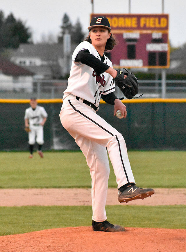 Enumclaw High senior pitcher Drake Anderson prepares to deliver during the second inning of an April 6 game against the Fife Trojans. The Hornet lefty scattered five hits, struck out eight, issued no walks and allowed just one earned run during six innings of work. Despite the impressive numbers, Enumclaw fell 6-2. It was an entirely different story a night earlier when the Hornets pummeled Fife 24-1. Photo by Kevin Hanson