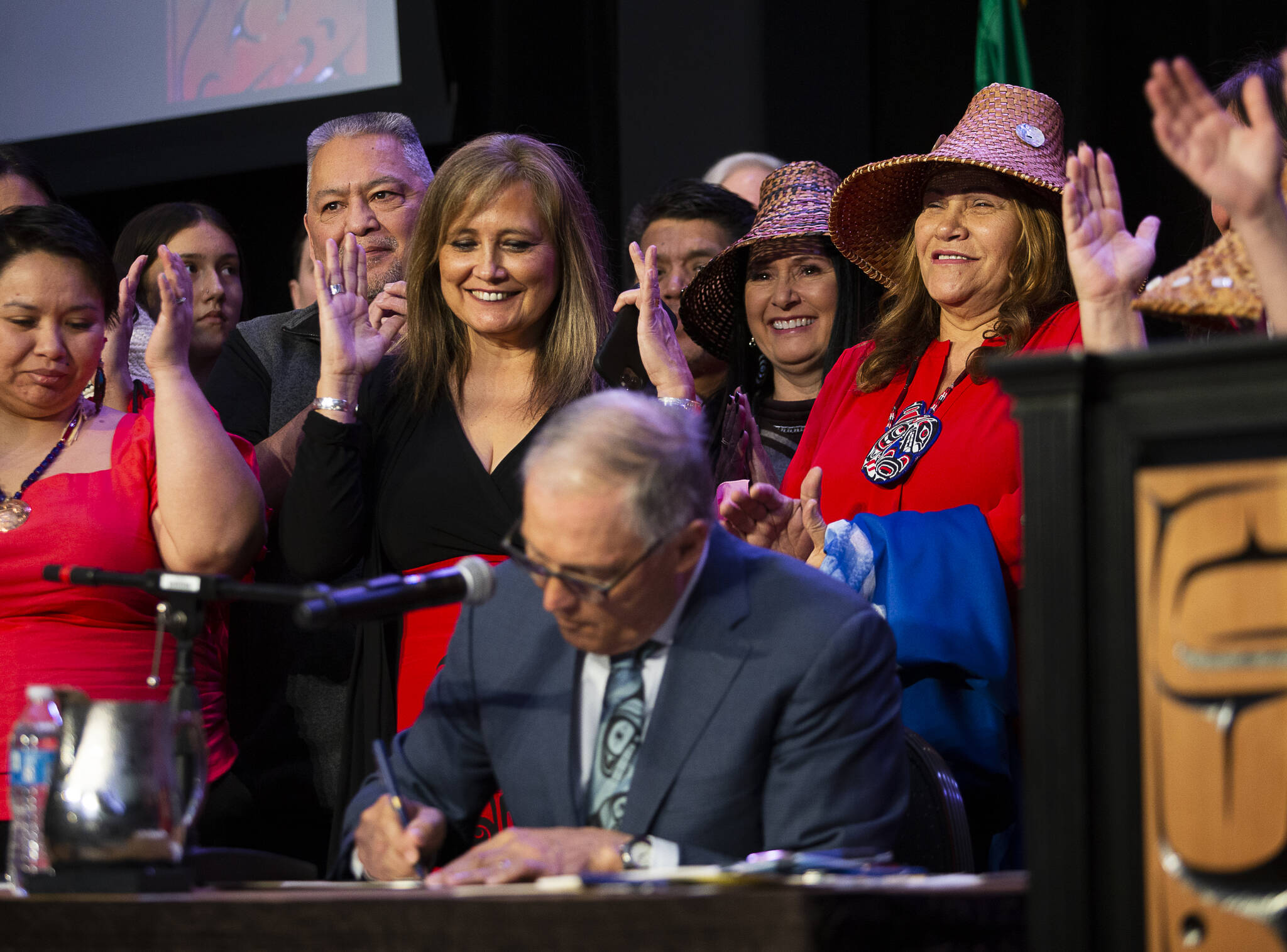 Photo by Olivia Vanni/The Herald
Governor Jay Inslee signs bill HB 1571, a bill relating to protections and services for indigenous persons who are missing, murdered, or survivors of human trafficking, into law at the Tulalip Resort on March 31, 2022.