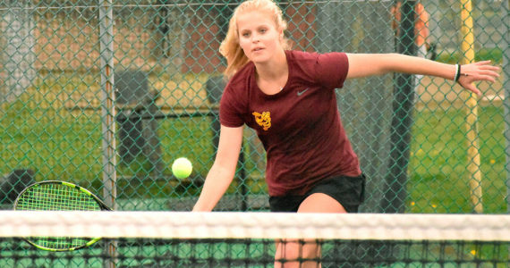 Leading the charge for the undefeated Enumclaw High girls' tennis team is junior Macy Furtwangler, the reigning league MVP. In this photo from an early-season match she races to the net to secure another point. Photo by Kevin Hanson