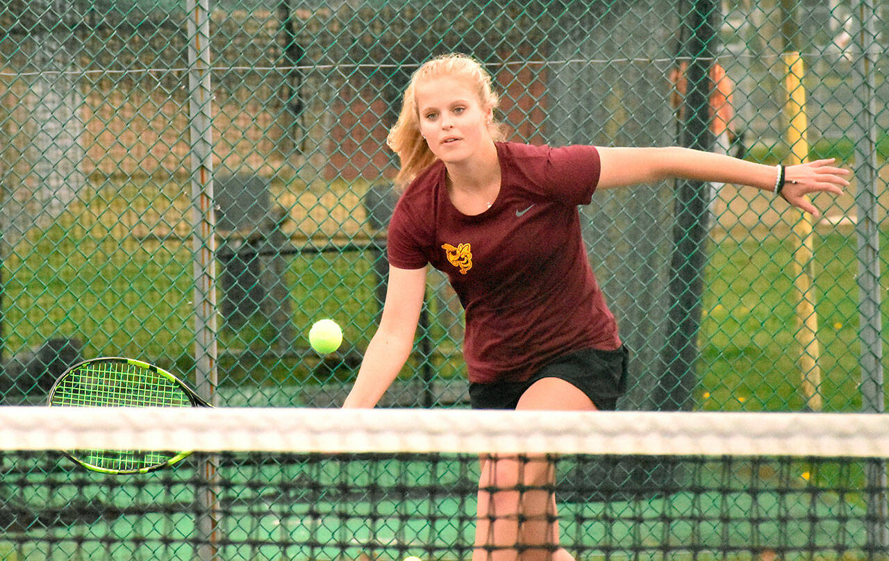 Leading the charge for the undefeated Enumclaw High girls' tennis team is junior Macy Furtwangler, the reigning league MVP. In this photo from an early-season match she races to the net to secure another point. Photo by Kevin Hanson