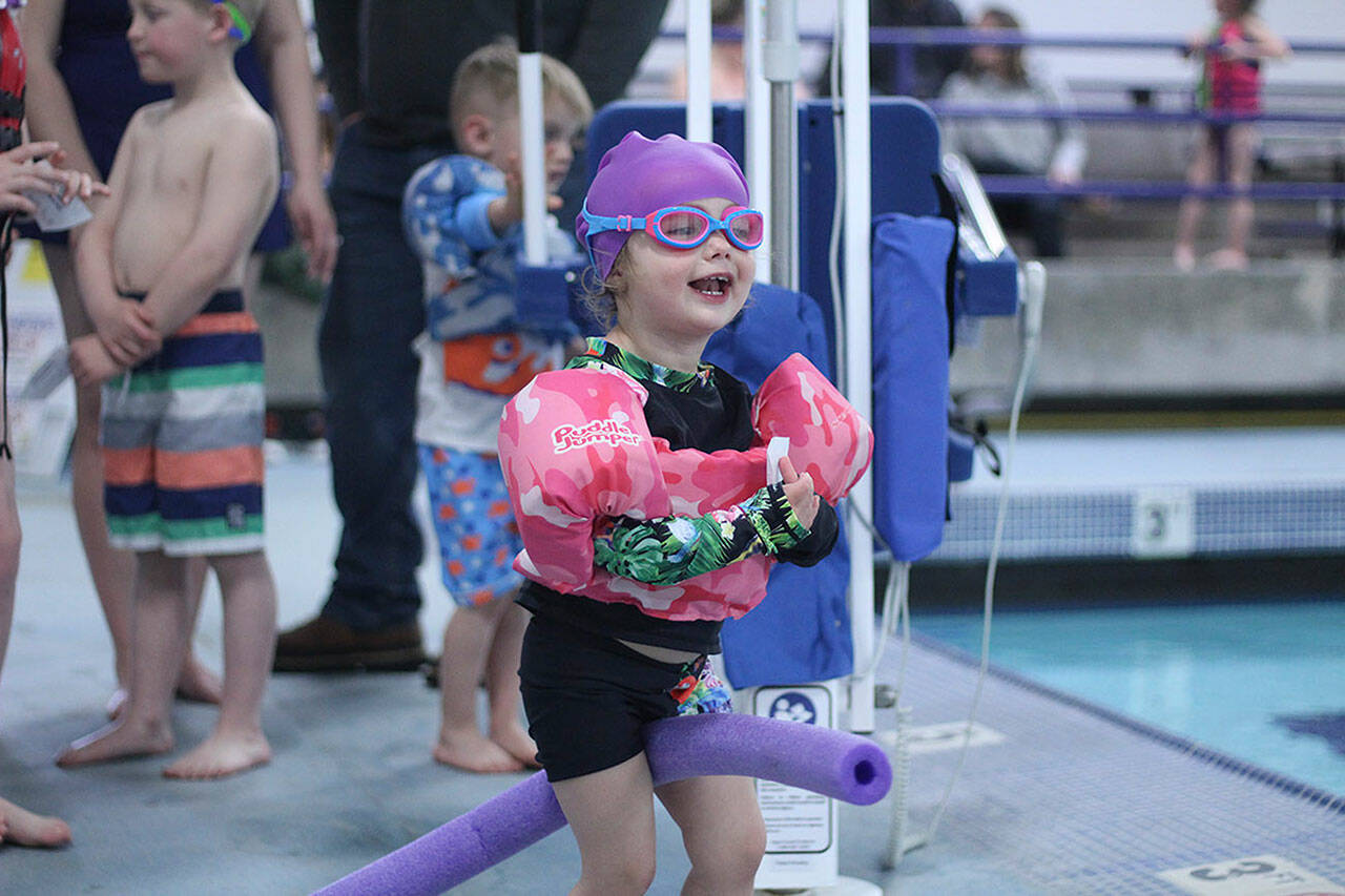 Whether you’re at the pool or the beach, water safety is paramount — which is why the Enumclaw Aquatic Center hosted April Pool’s Day on April 16, teaching kids of all ages the importance of a properly-fitted life jacket, how to rescue someone with a life preserver, and how to get in and out of a boat safely. Pictured is Eve Funk, rocking her her pool fit. Photo by Ray Miller-Still