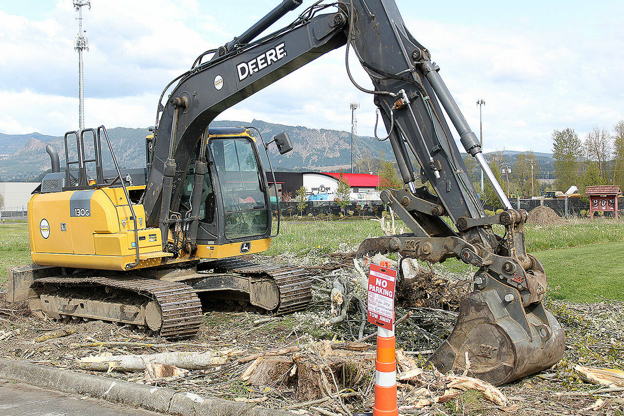 In conjunction with city improvement to streets and parking lots, the Thunder Dome Car Museum, seen in the background, is preparing to pave over the field behind the Enumclaw library to turn it into a parking lot. It will mostly be public use, though the museum can close it for private functions up to 48 hours at a time (up to 12 times a year, and never no more than twice during a single month), and for a full seven consecutive days once per year. A timeline on this project is not yet set, but ground should be broken "soon" with a goal to complete by summer's end, a representative of the museum said. Photo by Ray Miller-Still